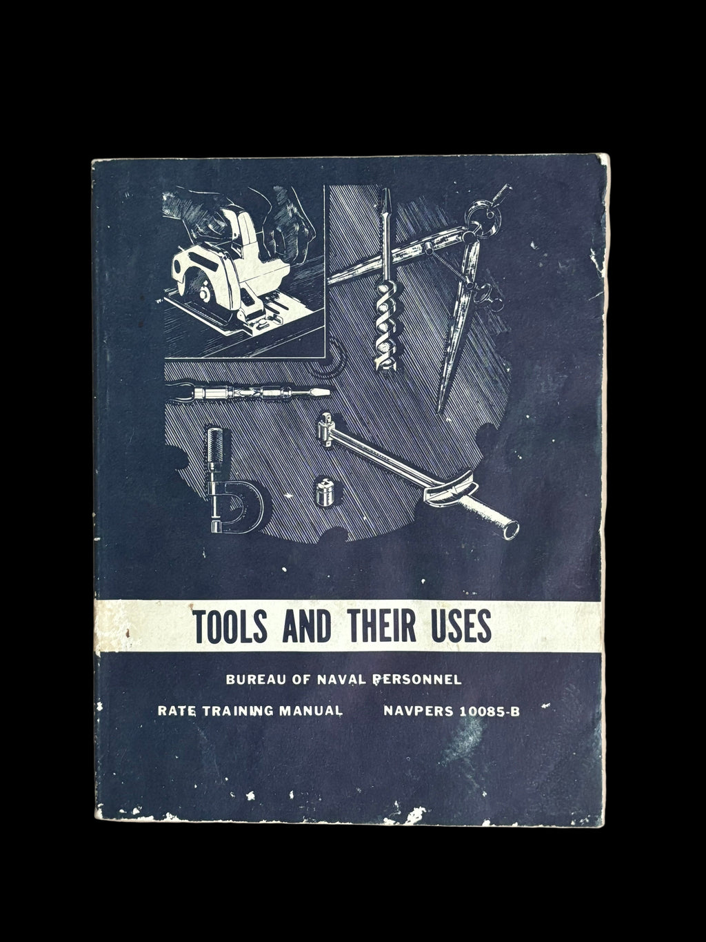 Book titled 'Tools and Their Uses' by Bureau of Naval Personnel on a beige background
