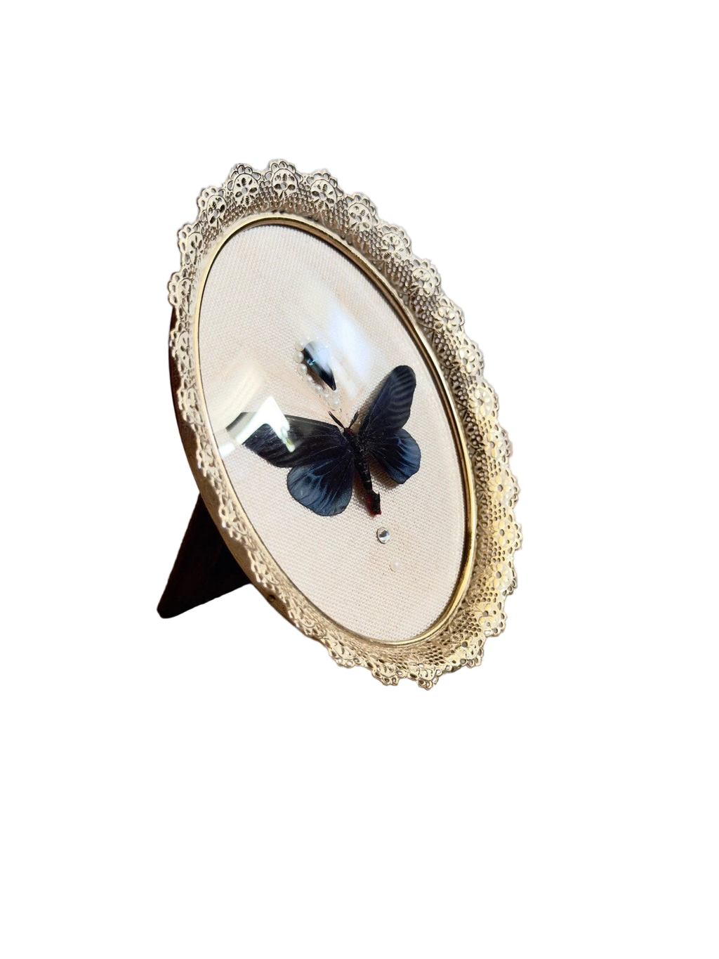 Decorative stand with a butterfly design on a plain background